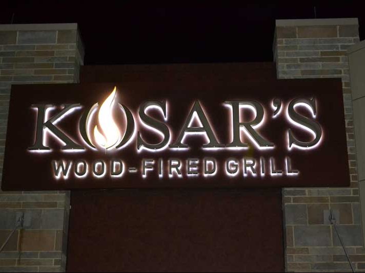 Logo signage for Kosar's Wood-Fired Grill in Northfield