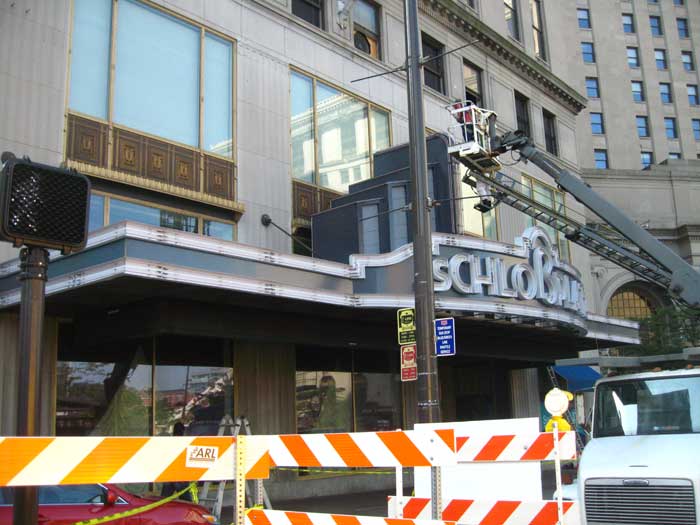 Maintenance of the Schloßplatz sign during filming for The Avengers in Cleveland